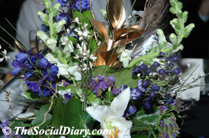 floral center piece with white and purple flowers